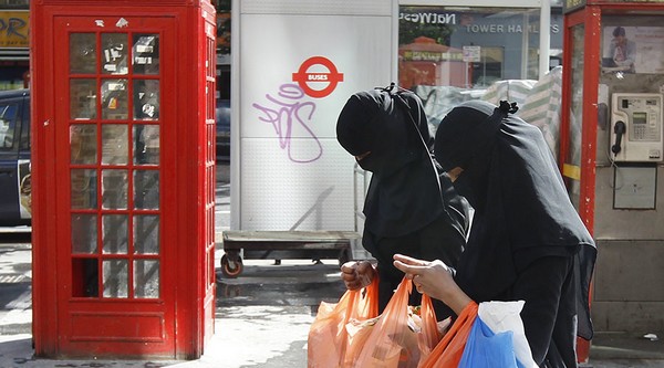 Women wears full-face veils as they shop in London